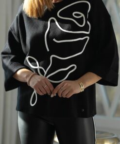 Pull avec déco fleur cousu